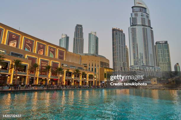 visiting the dubai mall - dubai mall stock pictures, royalty-free photos & images