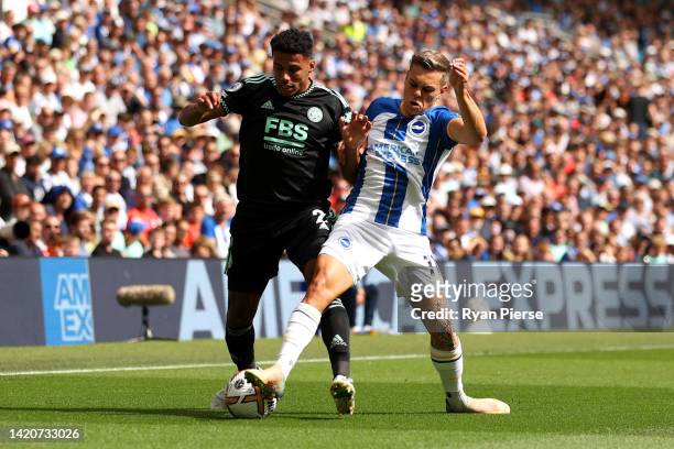 James Justin of Leicester City is challenged by Leandro Trossard of Brighton & Hove Albion during the Premier League match between Brighton & Hove...