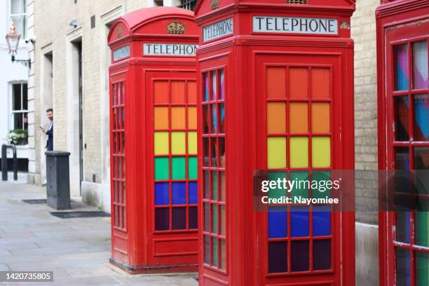 rainbow phone box in london - pride london stock pictures, royalty-free photos & images