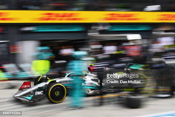 Lewis Hamilton of Great Britain driving the Mercedes AMG Petronas F1 Team W13 makes a pitstop during the F1 Grand Prix of The Netherlands at Circuit...