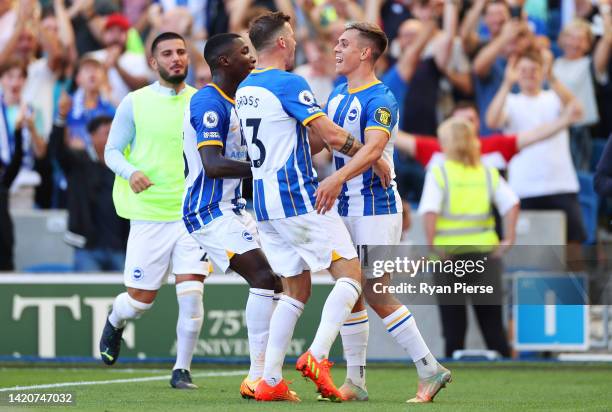 Leandro Trossard of Brighton & Hove Albion celebrates with team mates Moises Caicedo and Pascal Gross after scoring their sides third goal during the...