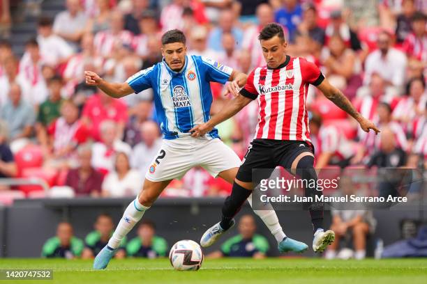 Alex Berenguer of Athletic Club battles for possession with Oscar Gil of Espanyol during the LaLiga Santander match between Athletic Club and RCD...
