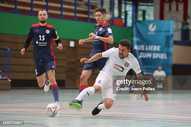 Pedro Henrique Strickert Rodrigues of HOT 05 and Durim Elezi of WAKKA compete for the ballduring the Futsal Bundesliga match WAKKA EAGLES FUTSAL and...