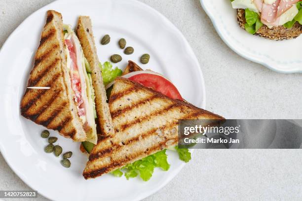 tasty club sandwich on a plate - gala table stock pictures, royalty-free photos & images