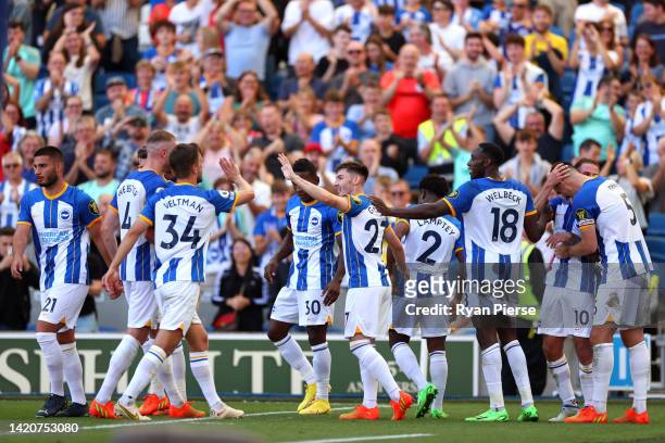 Alexis Mac Allister of Brighton & Hove Albion celebrates with team mates after scoring their sides fifth goal during the Premier League match between...
