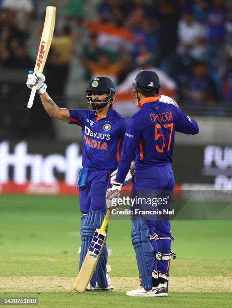 Virat Kohli of India is congratulated by Deepak Hooda of India after reaching his half century during the DP World Asia Cup match between India and...