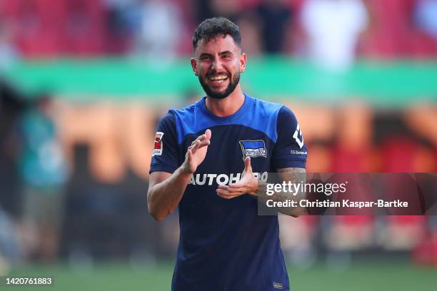 Marco Richter of Hertha BSC applauds fans following their sides victory after the Bundesliga match between FC Augsburg and Hertha BSC at WWK-Arena on...