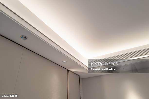 low angle view of ceiling air outlet - soffitto foto e immagini stock