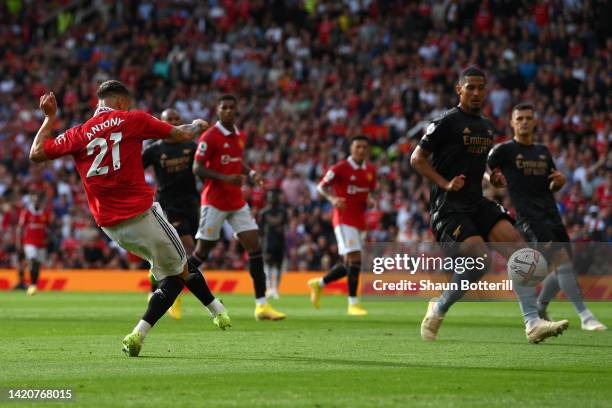 Antony of Manchester United scores their sides first goal during the Premier League match between Manchester United and Arsenal FC at Old Trafford on...