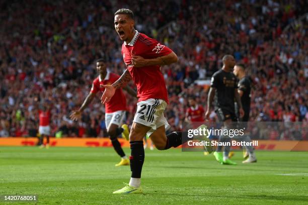 Antony of Manchester United celebrates after scoring their sides first goal during the Premier League match between Manchester United and Arsenal FC...