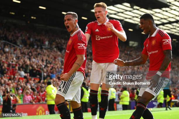 Antony of Manchester United celebrates with team mates Scott McTominay and Marcus Rashford after scoring their sides first goal during the Premier...