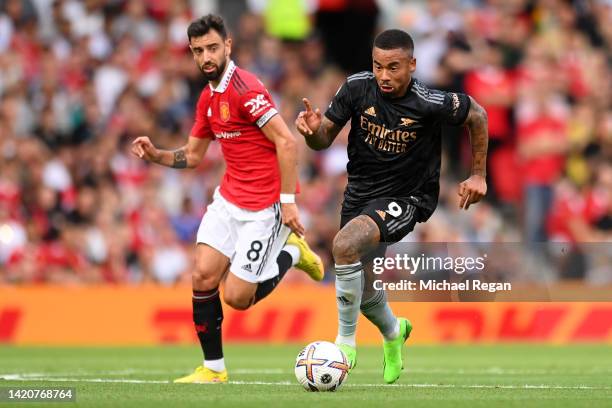 Gabriel Jesus of Arsenal is challenged by Bruno Fernandes of Manchester United during the Premier League match between Manchester United and Arsenal...