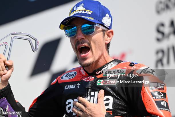 Maverick Vinales of Spain and Aprilia Racing celebrates the third place on the podium at the end of the MotoGP race during the MotoGP Of San Marino -...