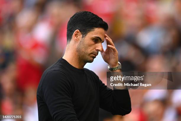 Mikel Arteta, Manager of Arsenal reacts while leaving the pitch at half time during the Premier League match between Manchester United and Arsenal FC...