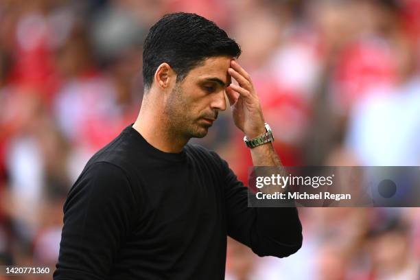 Mikel Arteta, Manager of Arsenal reacts while leaving the pitch at half time during the Premier League match between Manchester United and Arsenal FC...