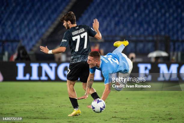 Sergej Milinković-Savić of SS Lazio and Khvicha Kvaratskhelia of SSC Napoli compete for the ball during the Serie A match between SS Lazio and SSC...