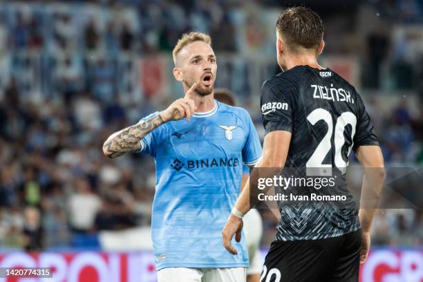 Manuel Lazzari of SS Lazio and Piotr Zieliński of SSC Napoli they discuss animatedly after a game fight during the Serie A match between SS Lazio and...