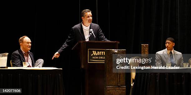 Kentucky head coach John Calipari talked about former LSU coach Dale Brown, left, before handing the Rupp Trophy to Anthony Davis, right, as The...