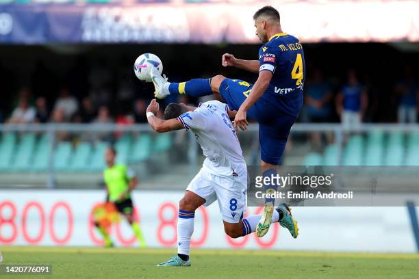 Miguel Veloso of Hellas Verona battles for possession with Tomas Rincon of UC Sampdoria during the Serie A match between Hellas Verona and UC...
