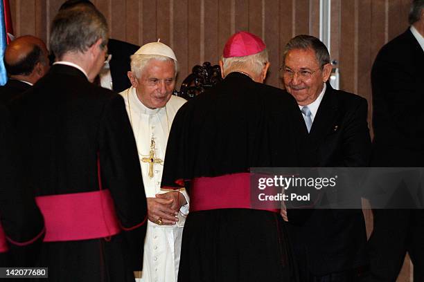 Pope Benedict XVI and Cuban President Raul Castro greet Bishops during a farewell ceremony as the Pope leaves Cuba after a three day visit on March...