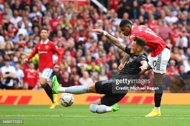 Marcus Rashford of Manchester United scores their sides second goal during the Premier League match between Manchester United and Arsenal FC at Old...