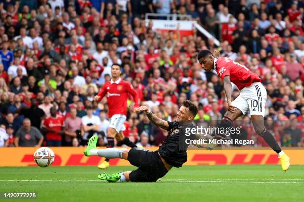 Marcus Rashford of Manchester United scores their sides second goal during the Premier League match between Manchester United and Arsenal FC at Old...