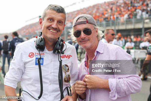 Guenther Steiner of Italy and Haas with ex Ferrari driver Eddie Irvine of Northern Ireland during the F1 Grand Prix of The Netherlands at Circuit...
