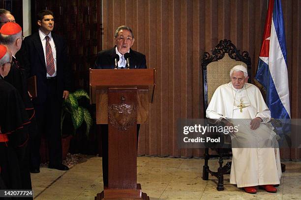 Pope Benedict XVI listens as Cuban President Raul Castro speaks during a farewell ceremony as the Pope leaves Cuba after a three day visit on March...