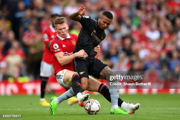 Scott McTominay of Manchester United tackles Gabriel Jesus of Arsenal during the Premier League match between Manchester United and Arsenal FC at Old...