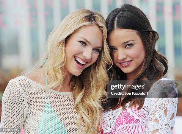 Candice Swanepoel and Miranda Kerr pose at Victoria's Secret Angels Miranda Kerr and Candice Swanepoel Launch The 2012 SWIM Collection at the...