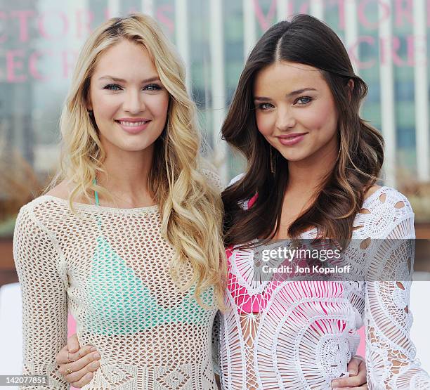 Candice Swanepoel and Miranda Kerr pose at Victoria's Secret Angels Miranda Kerr and Candice Swanepoel Launch The 2012 SWIM Collection at the...