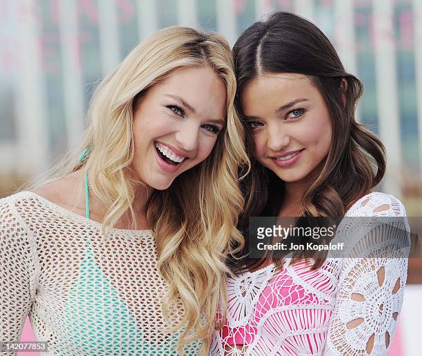 Candice Swanepoel and Miranda Kerr pose at Victoria's Secret Angels Miranda Kerr and Candice Swanepoel Launch The 2012 SWIM Collection at the...