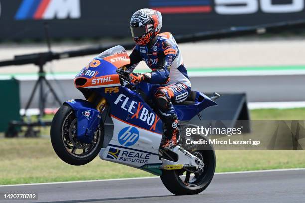 Aron Canet of Spain and Flexbox HP40 lifts the front wheel and celebrates the second place during the Moto2 race during the MotoGP Of San Marino -...