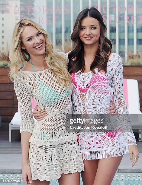 Candice Swanepoel and Miranda Kerr pose at Victoria's Secret Angels Miranda Kerr and Candice Swanepoel Launch The 2012 SWIM Collection at the...