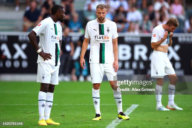 Marcus Thuram and Marvin Friedrich of Borussia Monchengladbach react during the Bundesliga match between Borussia Moenchengladbach and 1. FSV Mainz...