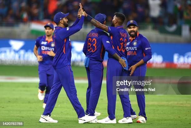 Hardik Pandya of India celebrates with team mates after dismissing Mohammad Rizwan of Pakistan during the DP World Asia Cup match between India and...