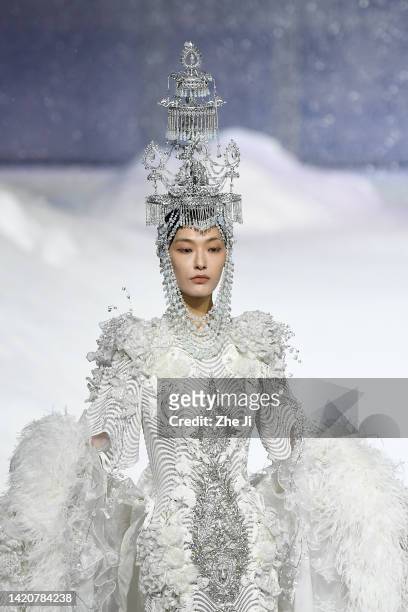 Model showcases designs on the runway at Heaven Gaia Collection show by designer Xiong Ying on day 1 of China Fashion Week 2023 S/S at 751D.PARK on...