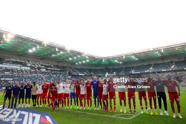 Mainz players celebrates with the fans following their side's victory in the Bundesliga match between Borussia Moenchengladbach and 1. FSV Mainz 05...