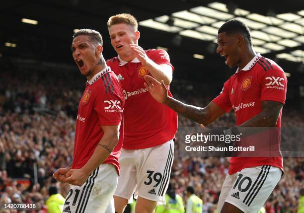 Antony of Manchester United celebrates with team mates Scott McTominay and Marcus Rashford after scoring during the Premier League match between...