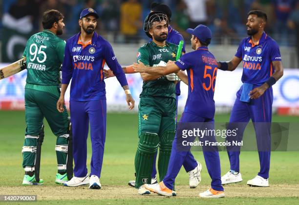 Iftikhar Ahmed of Pakistan and Khushdil Shah of Pakistan is congratulated by India after winning the DP World Asia Cup match between India and...