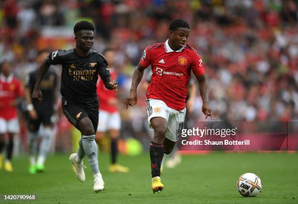 Tyrell Malacia of Manchester United runs with the ball during the Premier League match between Manchester United and Arsenal FC at Old Trafford on...