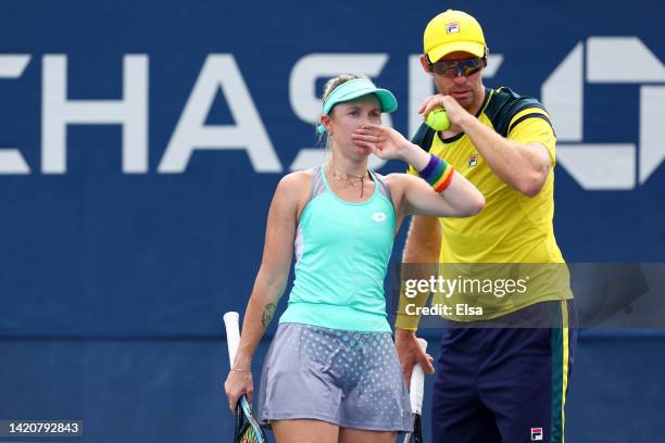 John Peers and Storm Sanders of Australia talk against Bernarda Pera and Jackson Withrow of the United States during their Mixed Doubles Second Round...