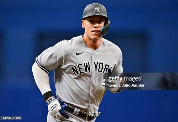 Aaron Judge of the New York Yankees rounds the bases on a 450-foot solo home run in the first inning against the Tampa Bay Rays at Tropicana Field on...