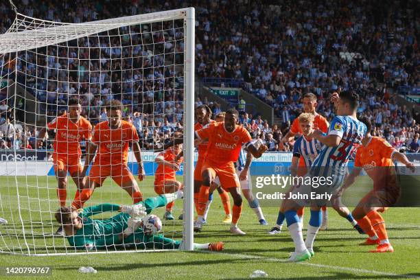 Yutu Nakayama of Huddersfield Town appears to score with the ball apparently crossing the goal line only for the goal not to be given after the goal...