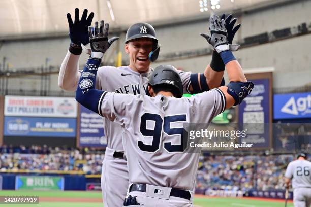 Aaron Judge of the New York Yankees celebrates with Oswaldo Cabrera after hitting a home run in the first inning against the Tampa Bay Rays at...