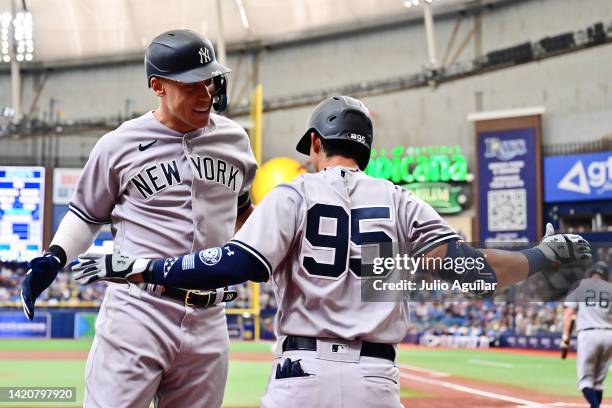 Aaron Judge of the New York Yankees celebrates with Oswaldo Cabrera after hitting a home run in the first inning against the Tampa Bay Rays at...