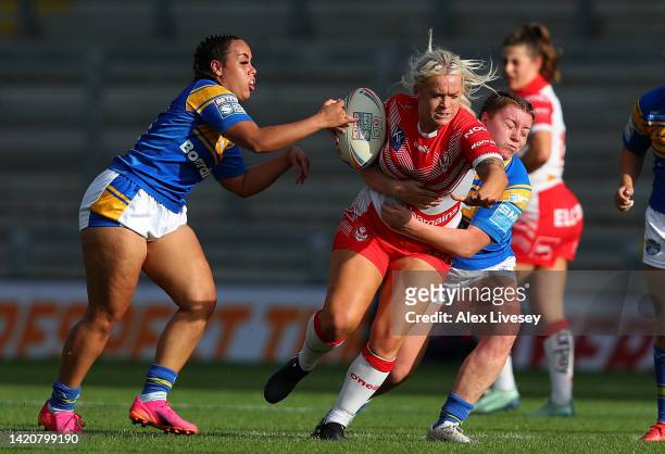 Shona Hoyle of St Helens is tackled by Dannielle Anderson of Leeds Rhinos during the Betfred Women's Super League Semi Final match between St Helens...