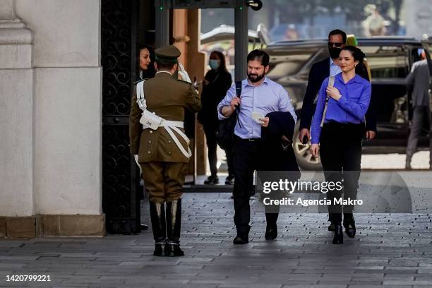 President of Chile Gabriel Boric arrives at La Moneda Palace with Irina Karamanos after casting their vote during the referendum to approve or reject...