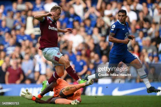 Jarrod Bowen of West Ham United fouls Edouard Mendy of Chelsea leading to a VAR decision to disallow West Ham's 2nd goal during the Premier League...