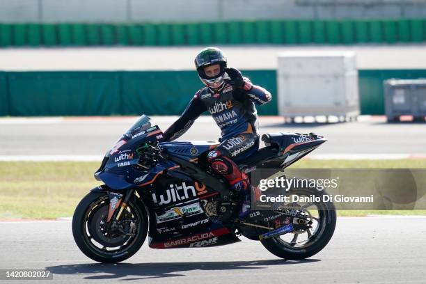 Andrea Dovizioso of Italy and WithU Yamaha RNF MotoGP™ Team great the fans at the end of race of the MotoGP Of San Marino at Misano World Circuit on...